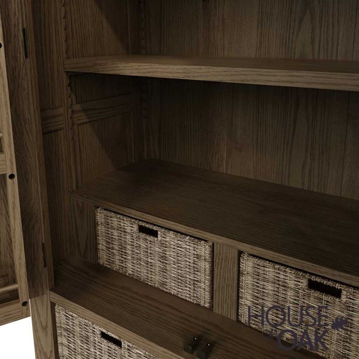 the inside of a an oak kitchen larder with various shelves and storage