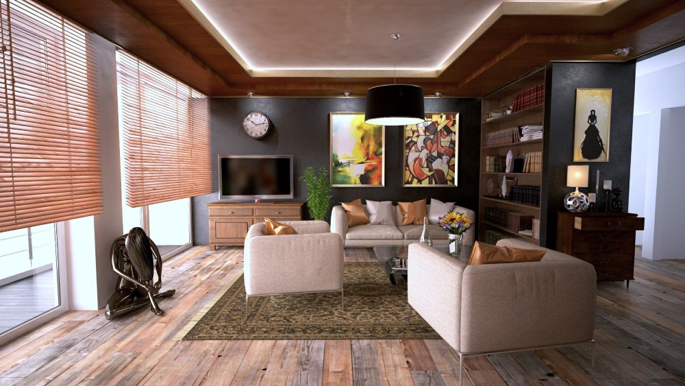 a modern living room with a sofa, two sofa chairs, coffee table and other decorations