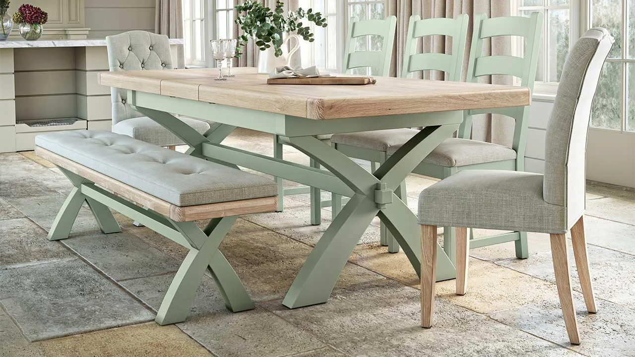 London Oak dining table and chairs in sage green, displayed in a contemporary British home